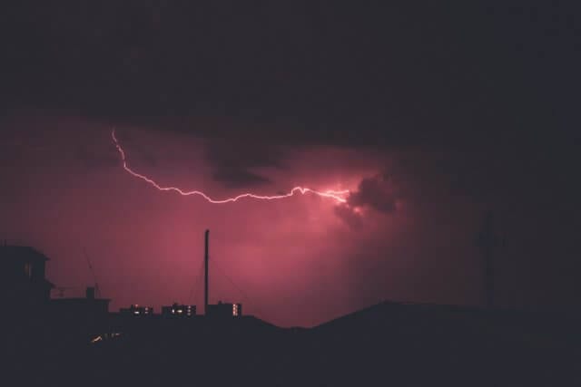 lightning striking industrial equipment