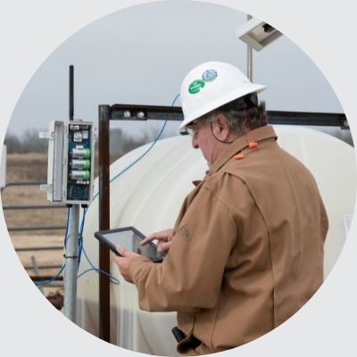 a chemical service provider checking a chemical pump controller with automation using a tablet mobile app